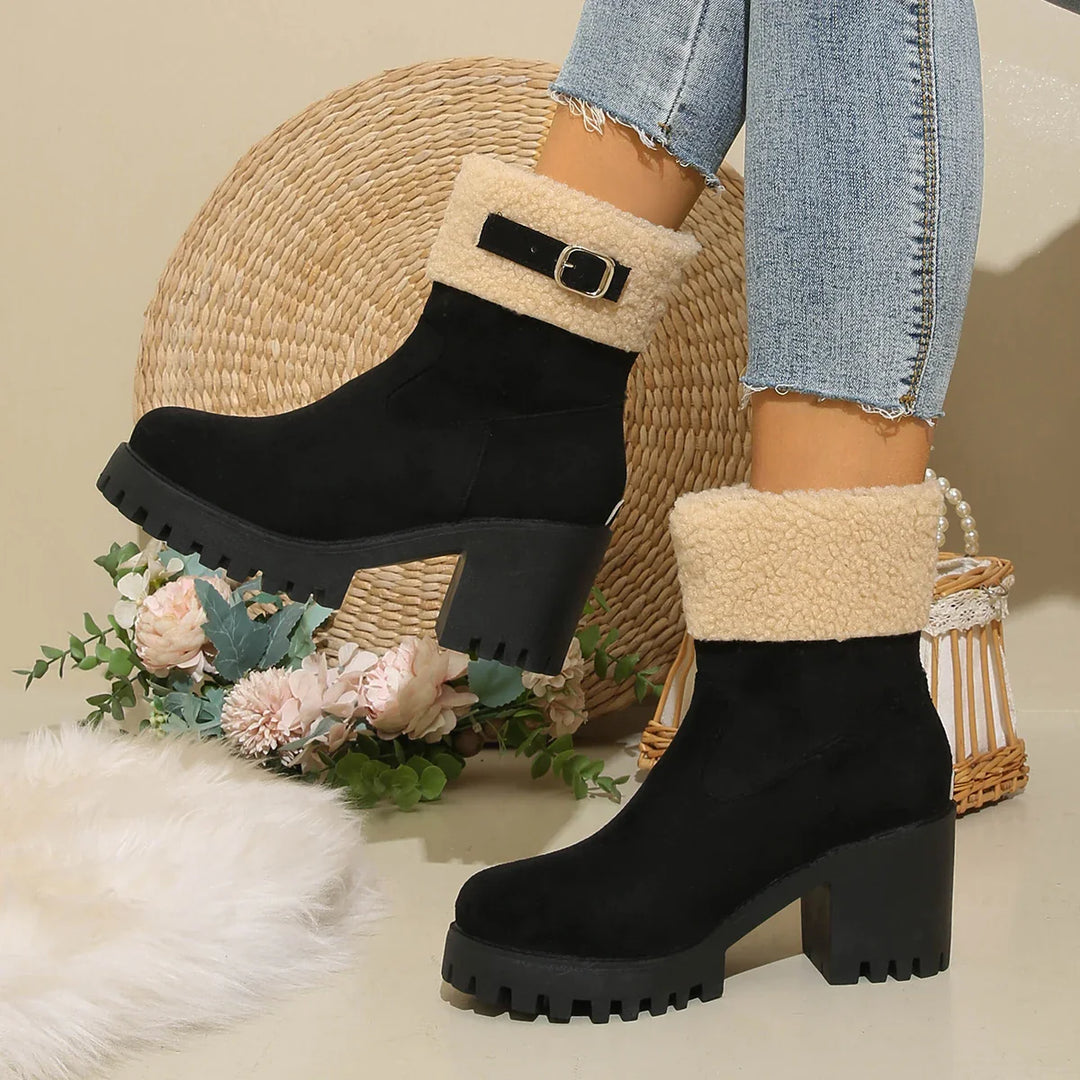 Durable women's ankle boots with a sherpa cuff, offering both warmth and a chic look.