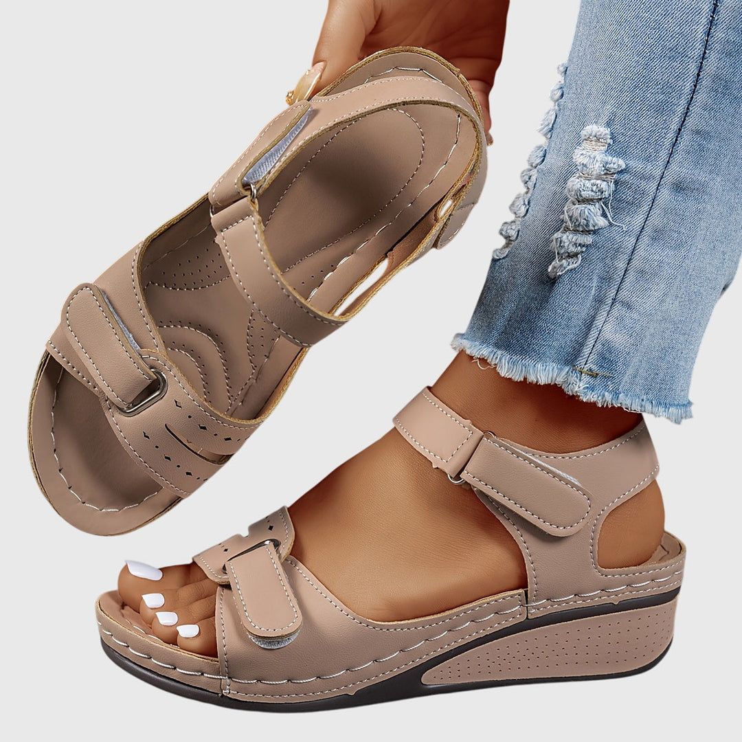 Stylish women's slip-on sandals with dazzling crystals, designed for orthopedic arch support and comfort.