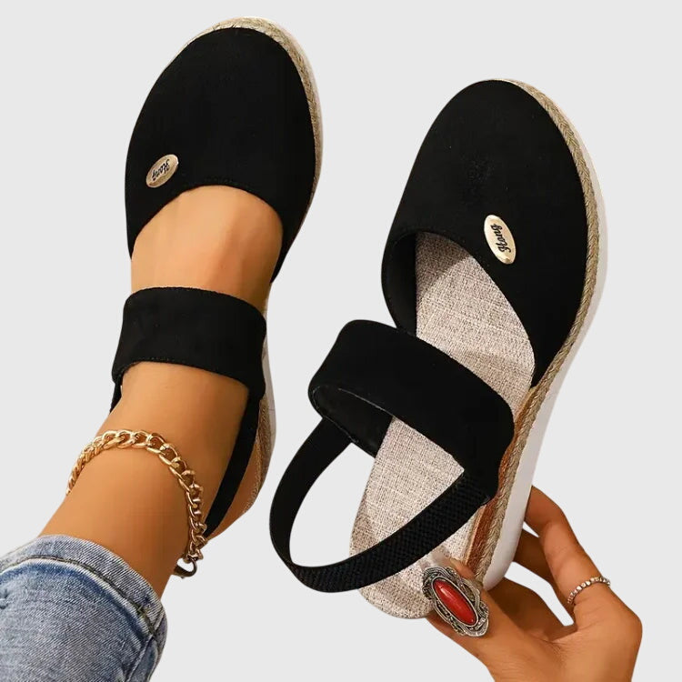 Women's orthopedic sandals on outdoor path, highlighting comfort, stability & pain relief for everyday wear.