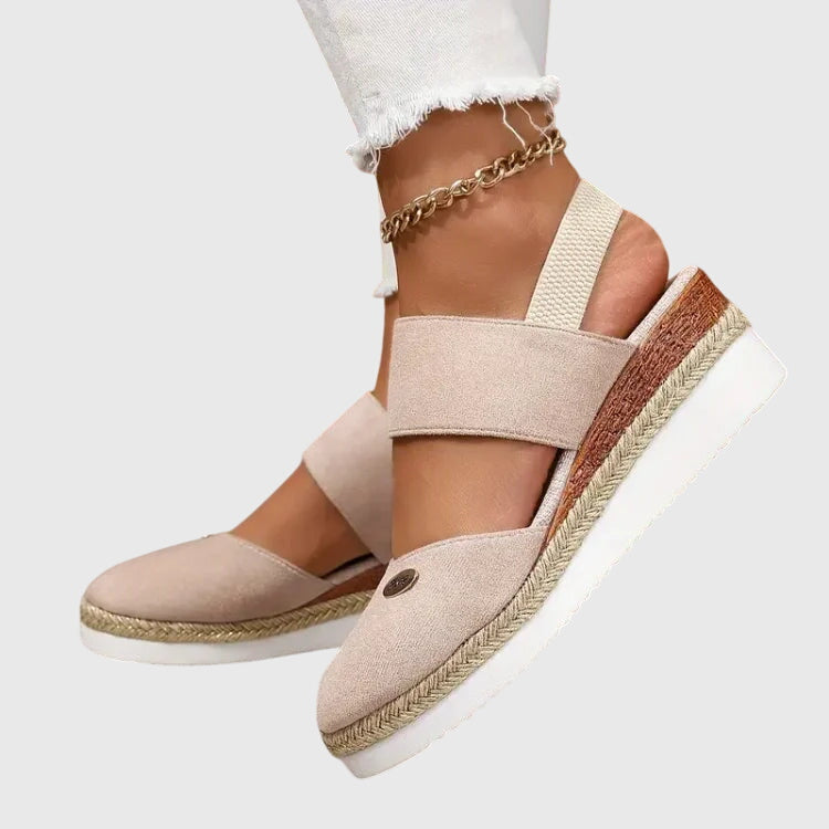 Textured women's orthopedic sandals with breathable straps, engineered for pain relief & comfortable walking.