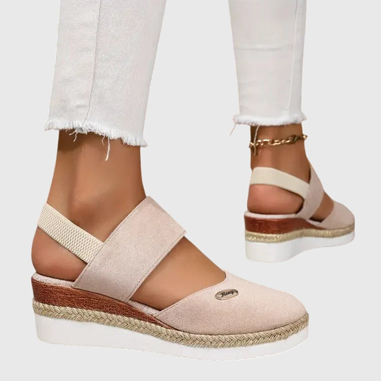 Stylish women's orthopedic sandals, sleek design, offering cushioned arch support & pain relief for walking.