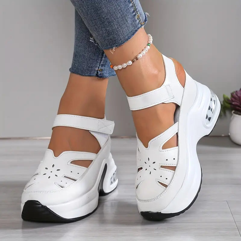 Adjustable women's wedge sandals, cushioned & breathable with stylish cutouts, great for summer walking.