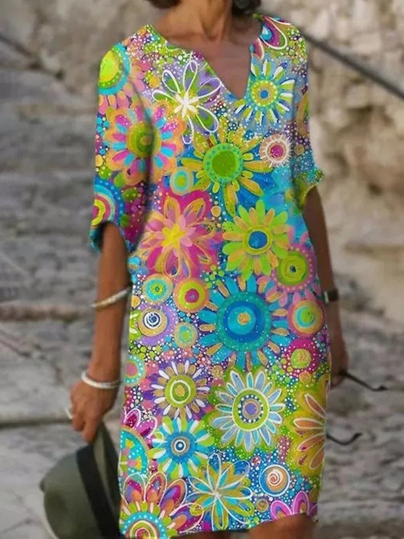 Elegant women's boho V-neck summer dress with abstract dahlia floral print. Ideal for beach, casual outings.