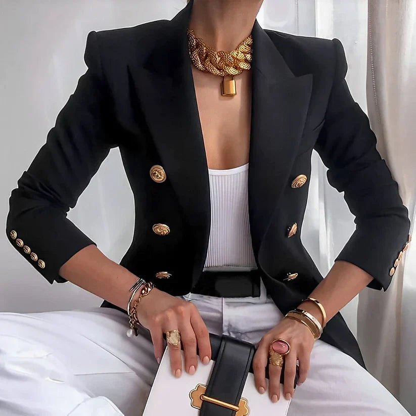 Women's double-breasted tailored blazer with prominent gold buttons, ideal for professional or formal wear.