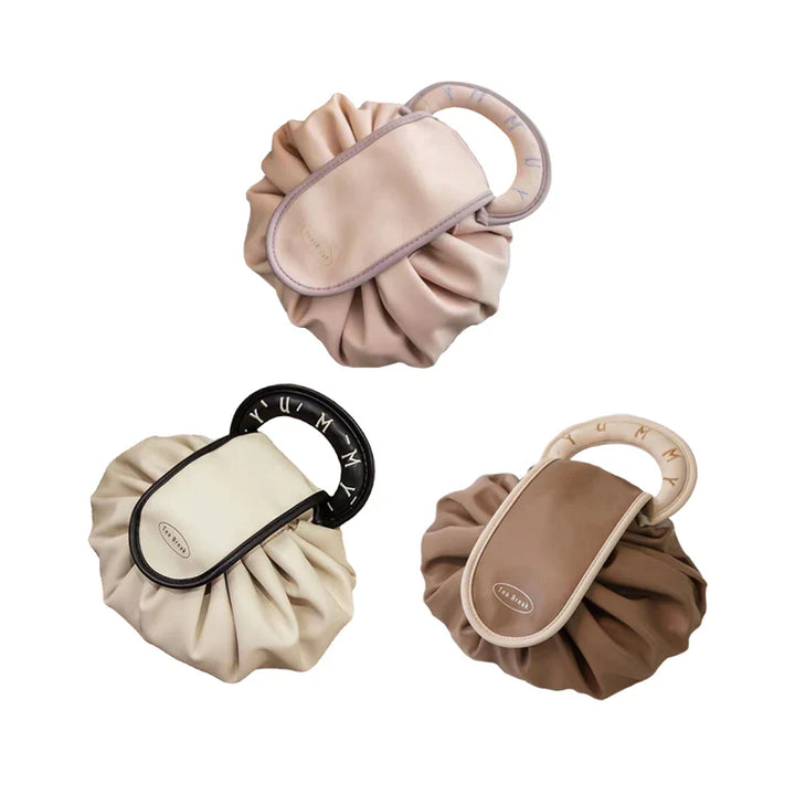 Women's drawstring travel bag, with various makeup items neatly arranged inside
