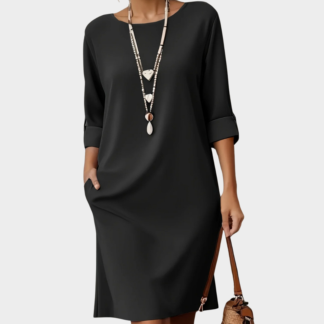 Elegant women's casual midi dress in an autumn style. Comfortable everyday wear with a flattering fit & 3/4 sleeves.