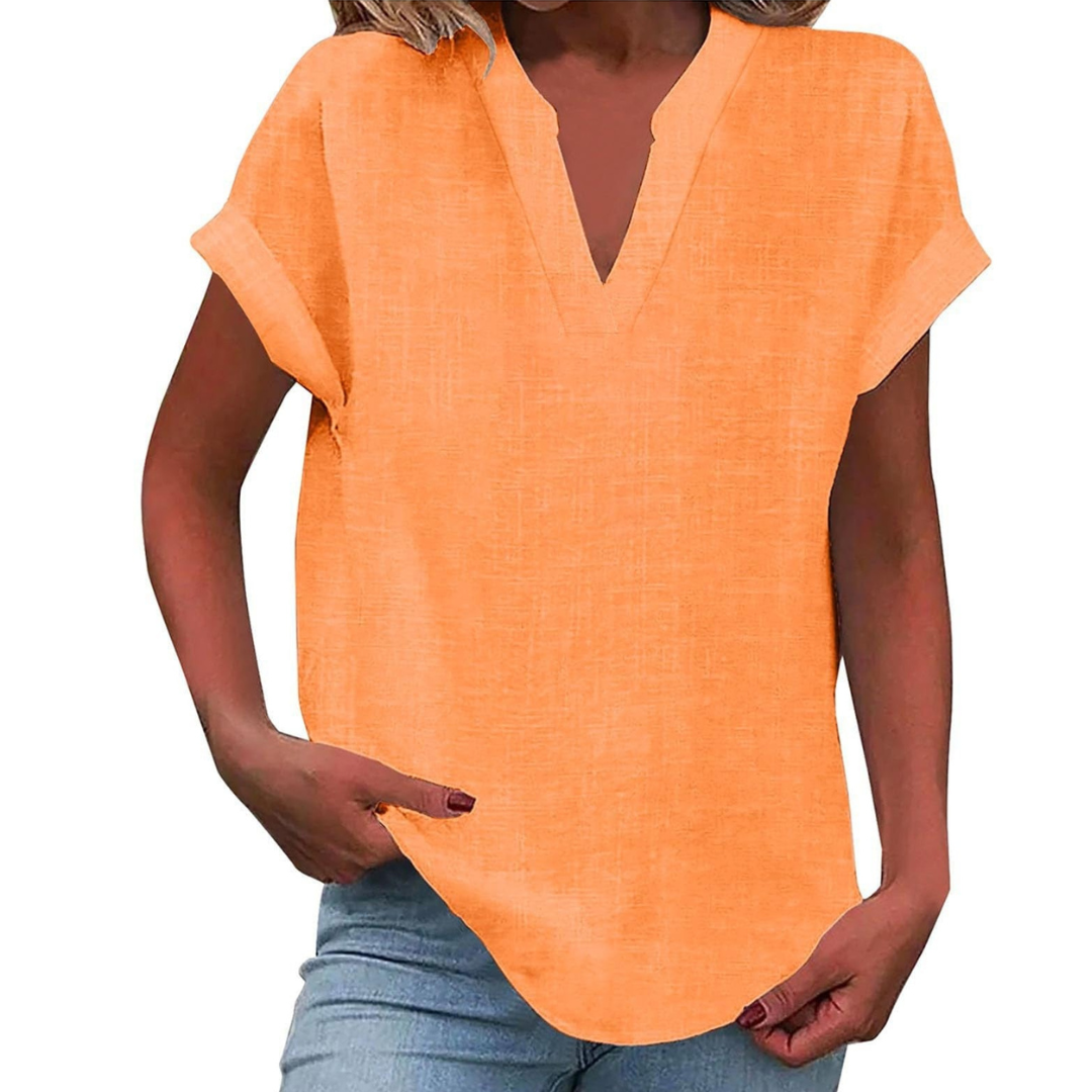 Stylish V-neck loose fit summer blouse, comfortable for warm weather casual wear.