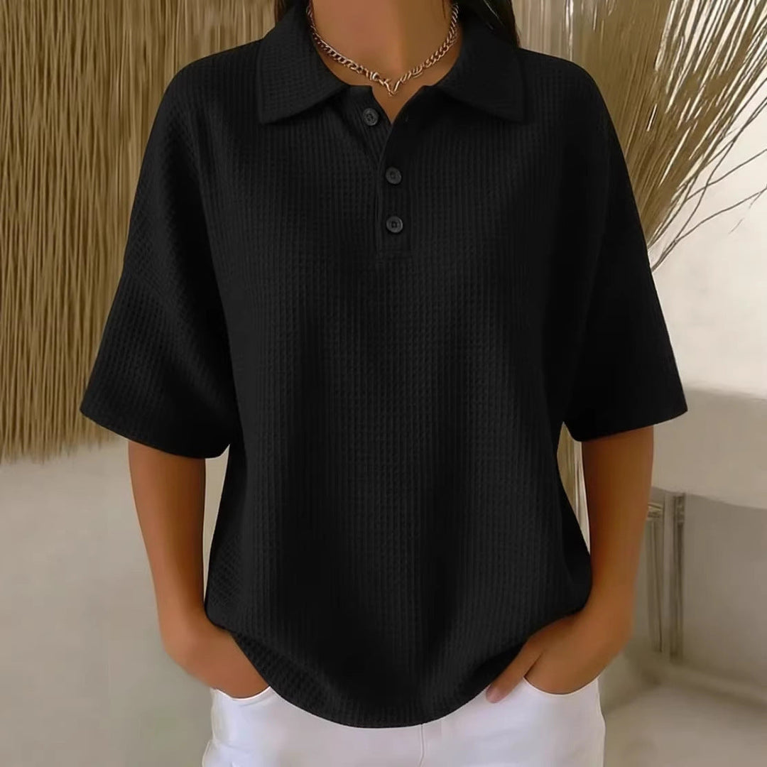 Loose fit women's waffle knit polo top, short sleeve, ideal for comfortable everyday style in spring and summer.