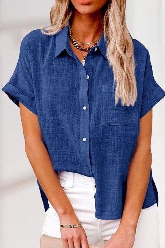 Classic long sleeve women's shirt with elegant buttons, perfect for a tailored work or casual look.