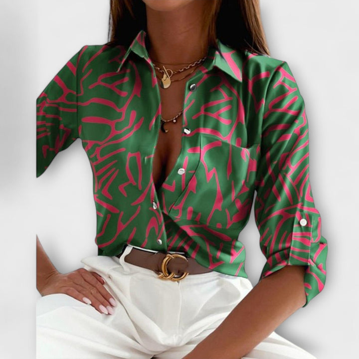 Close-up of the classic collar on a women's sophisticated long sleeve blouse, perfect for office wear.