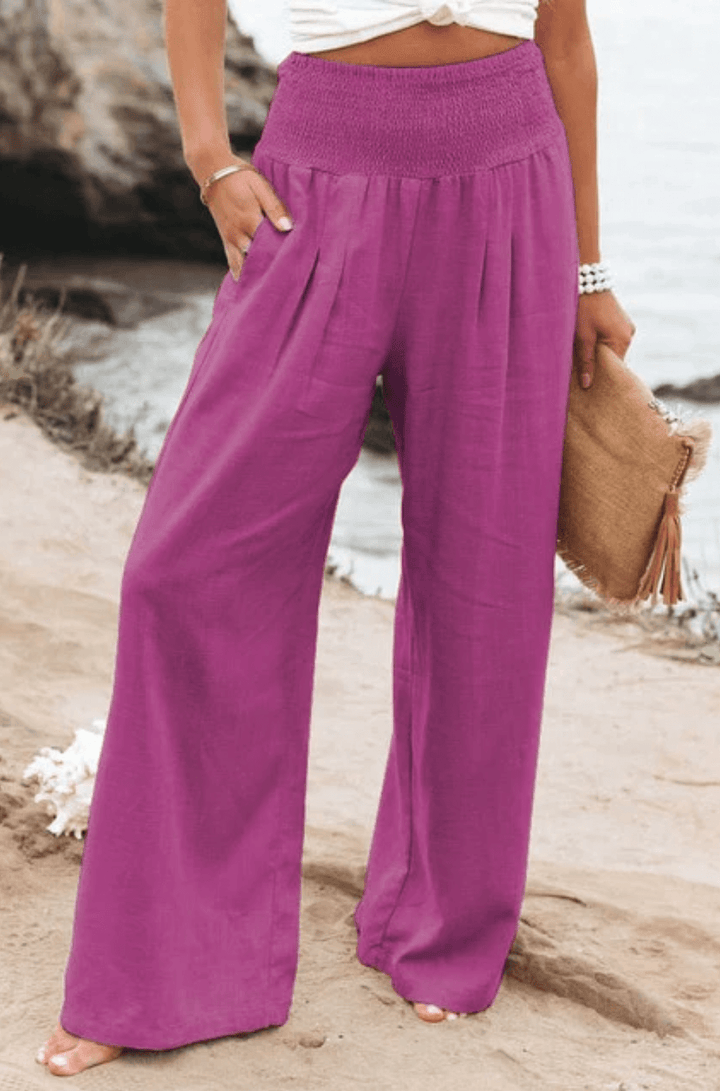Women's high-waist boho palazzo pants, elegant & flowy. Wide-leg comfort for summer casual fashion.