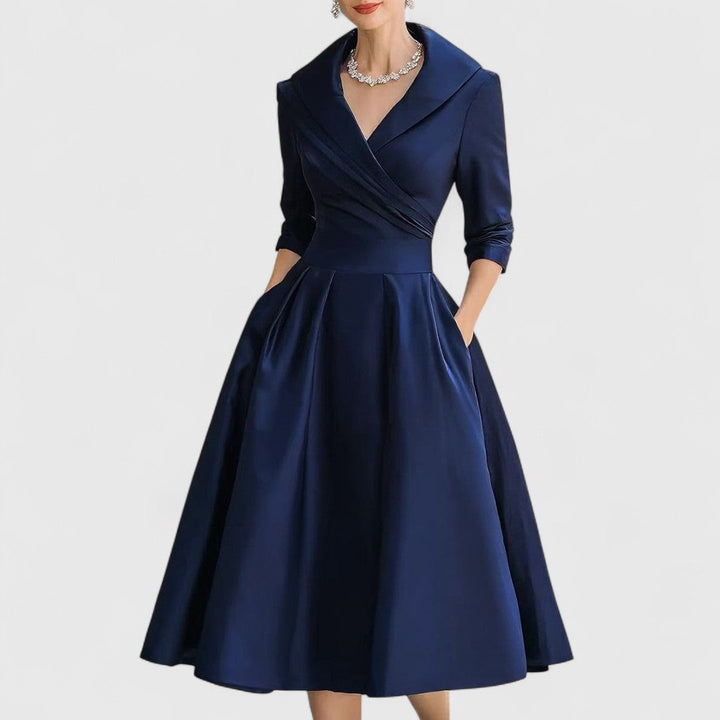Women's elegant V-neck midi dress with 3/4 sleeves, flattering fit for versatile style.
