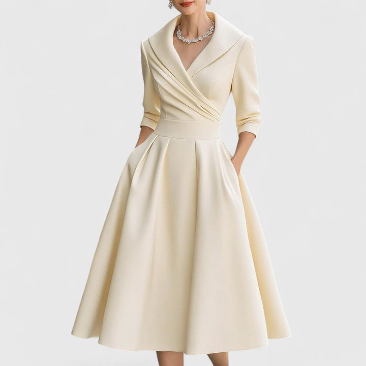 Elegant women's V-neck midi dress, 3/4 sleeves, offering sophisticated and effortless style.