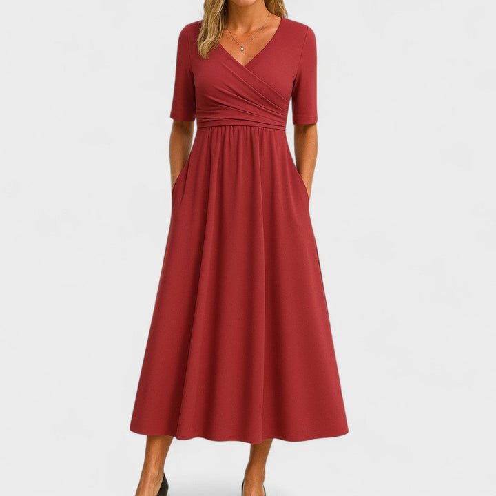 Fashionable women's elegant midi dress, V-neck, short sleeves. A versatile party dress for summer fashion.