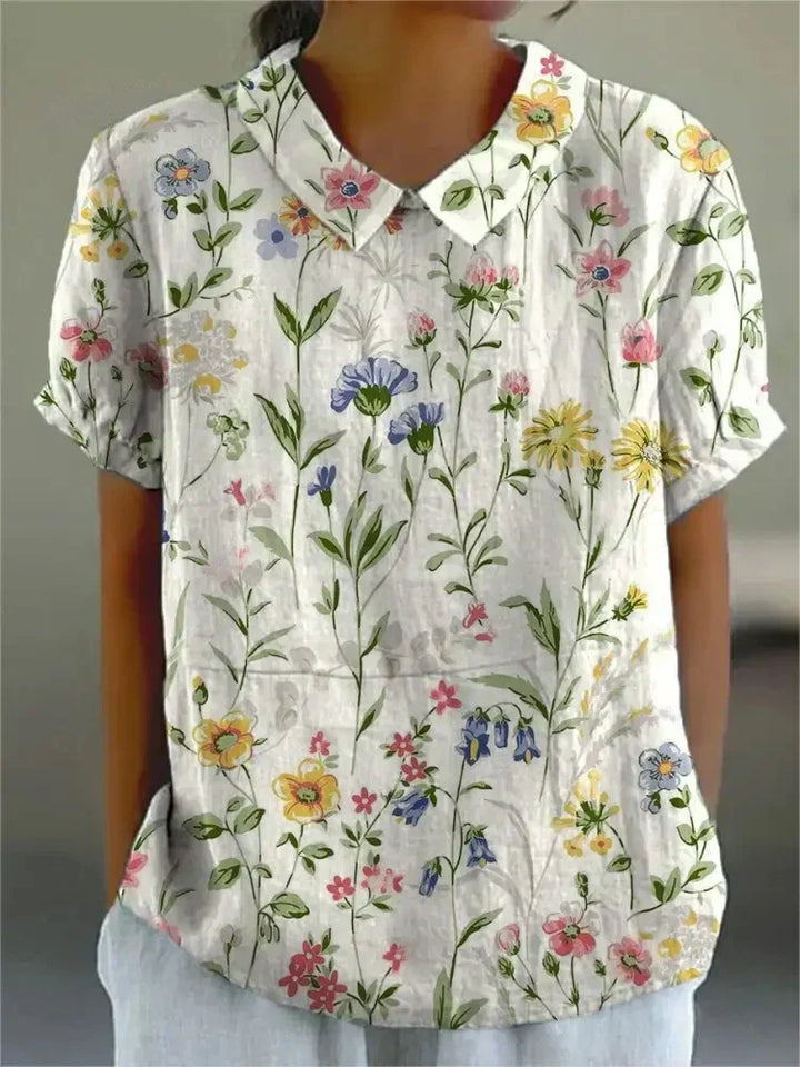 Elegant women's vintage style floral embroidered blouse, Peter Pan collar, perfect for summer outfits.