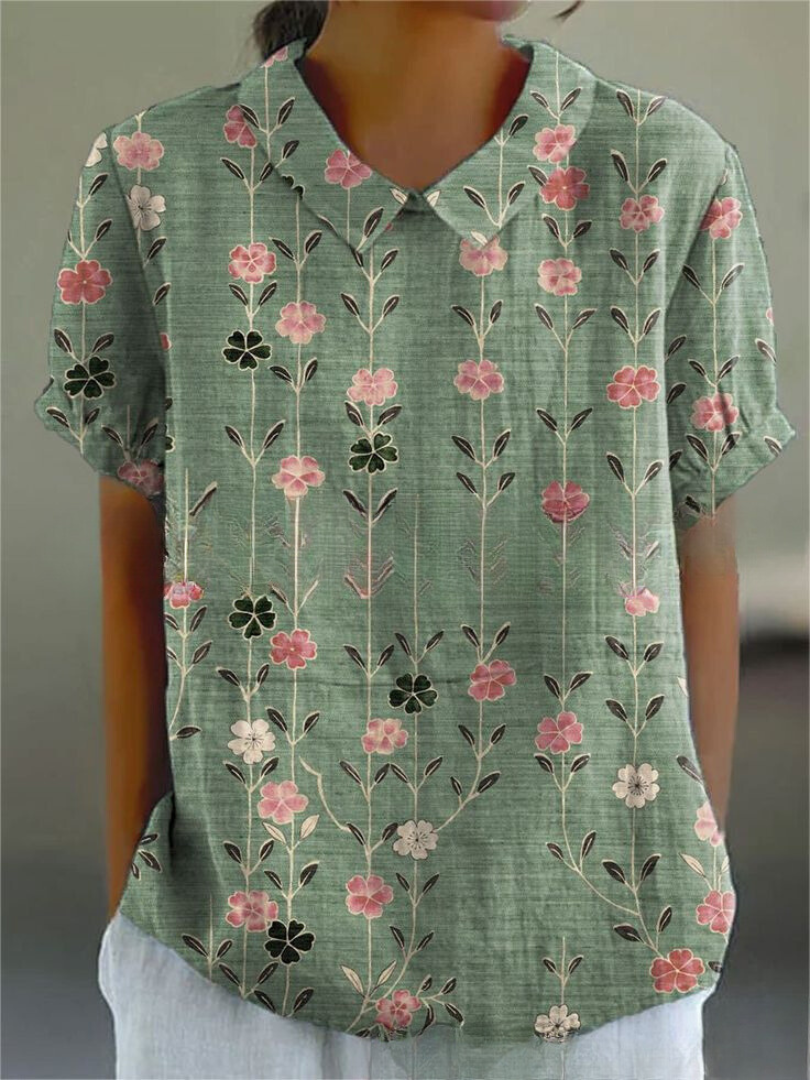 Women's elegant short sleeve floral embroidered blouse, featuring a stylish Peter Pan collar for versatile wear.