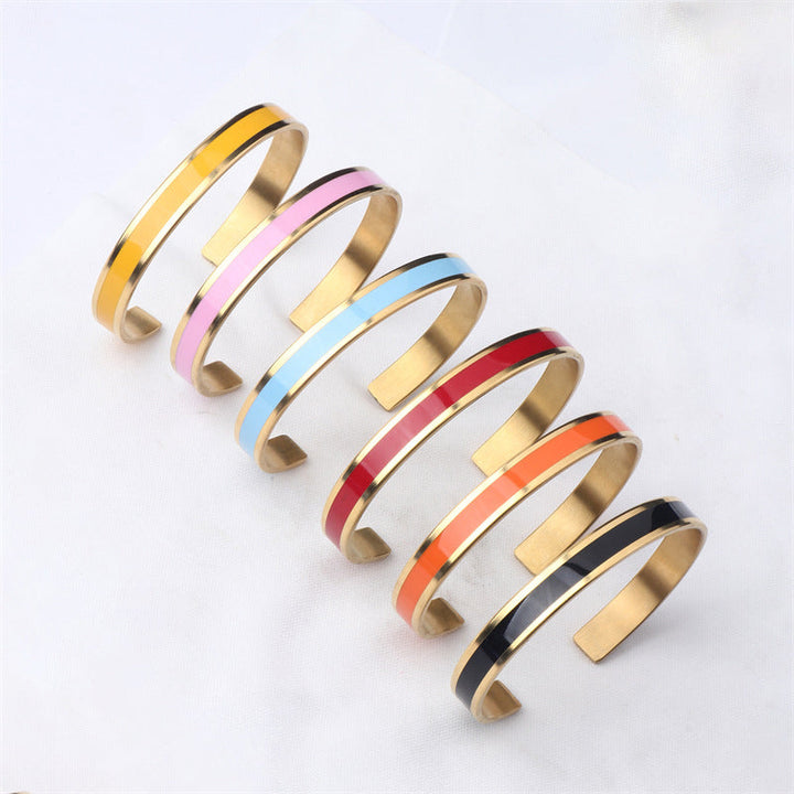 Collection of women's stainless steel bangles, various widths, all engraved for a personal touch