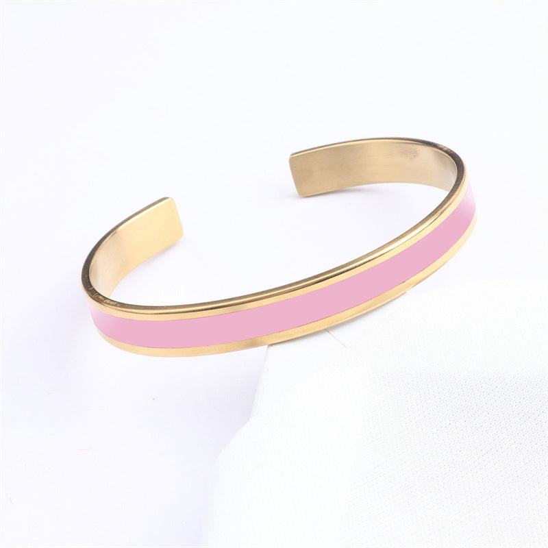 Women's engraved stainless steel bangle with a matte finish, modern and minimalist jewelry piece