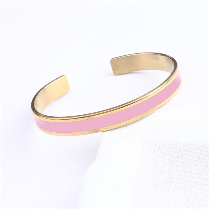 Women's engraved stainless steel bangle with a matte finish, modern and minimalist jewelry piece