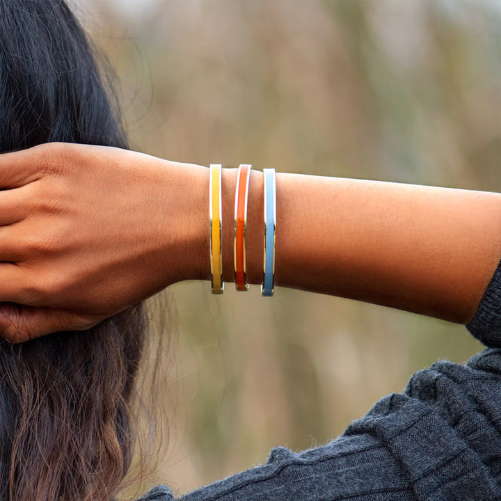 Three stainless steel bangles with different colored enamel accents, 'Be Kind' engraved, women's jewelry