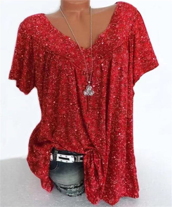 Lightweight women's boho top with flutter sleeves & a lovely floral pattern, perfect for warm weather.