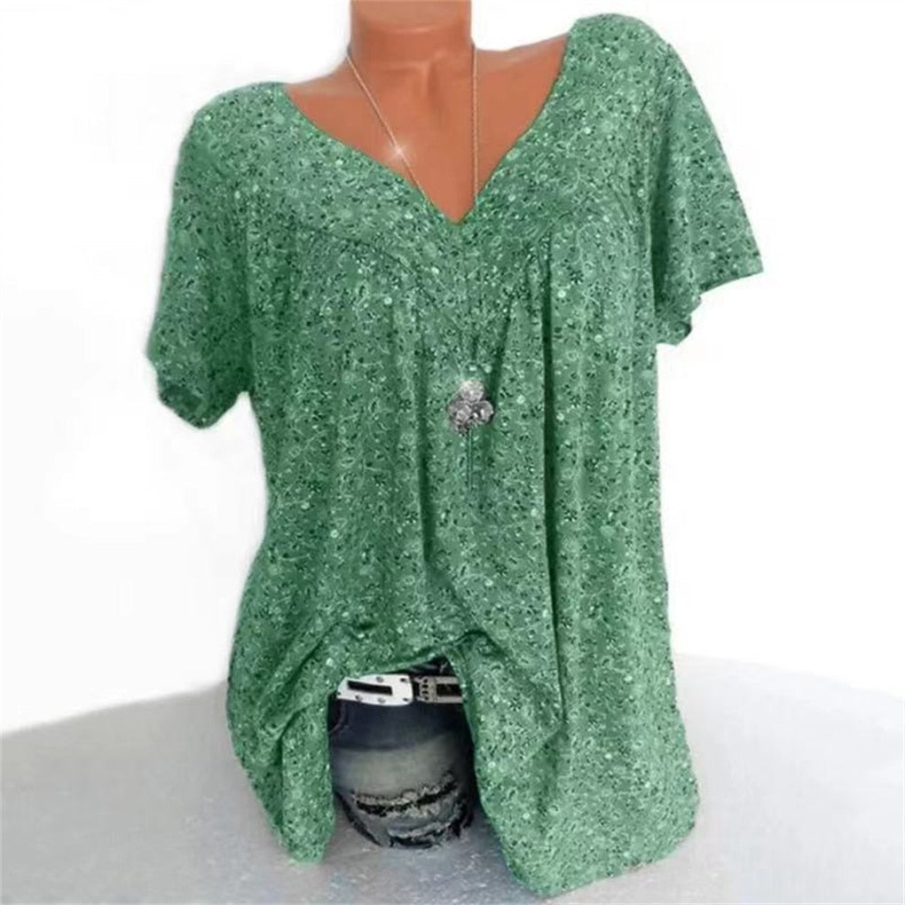 Women's relaxed fit floral summer blouse with stylish flutter sleeves and a V-neckline.