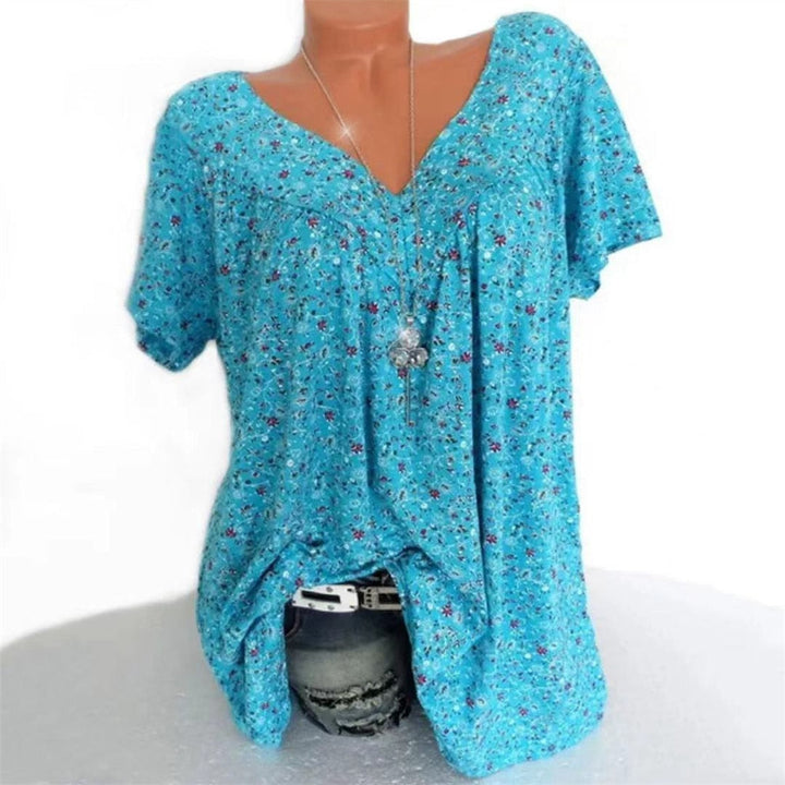 Relaxed fit boho summer top with an elegant floral design and comfortable flutter sleeves.