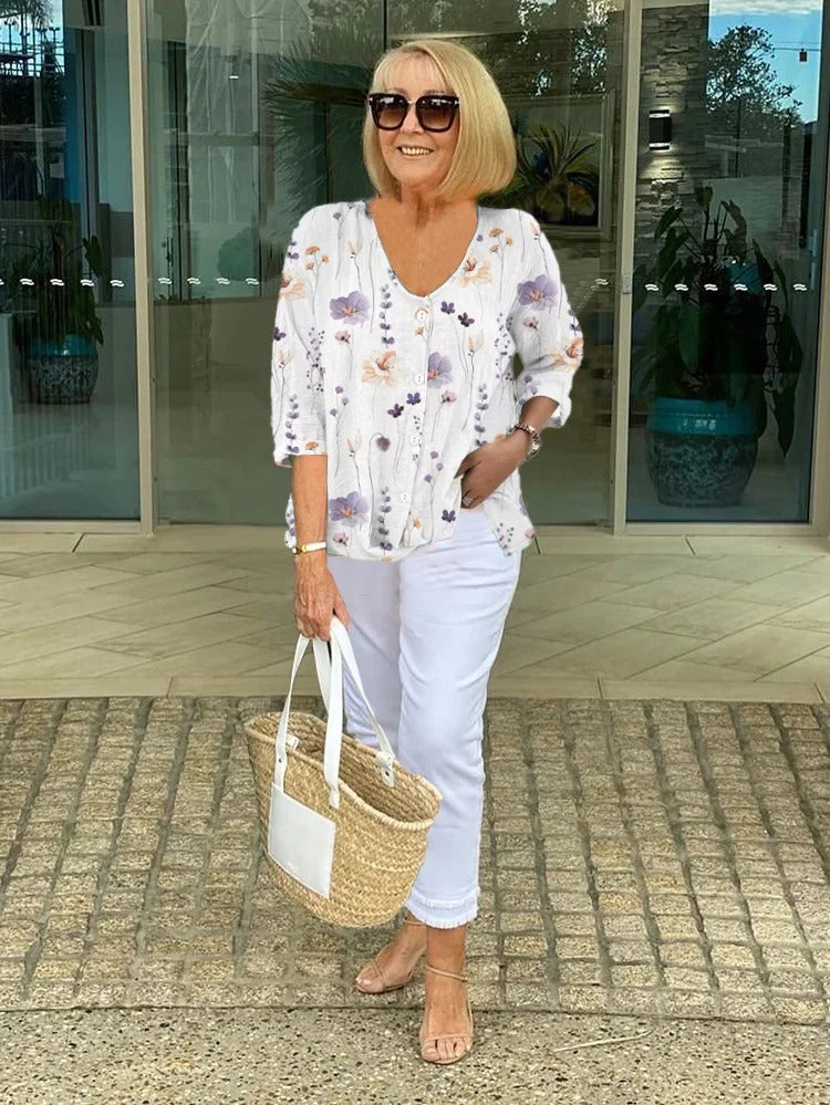 Relaxed fit women's floral button-front V-neck blouse, great for spring fashion & comfortable summer style.