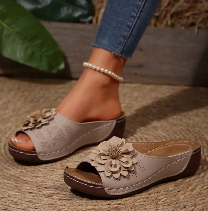 Detailed shot of the comfort footbed in Women's Floral Slide Sandals, ideal for extended wear