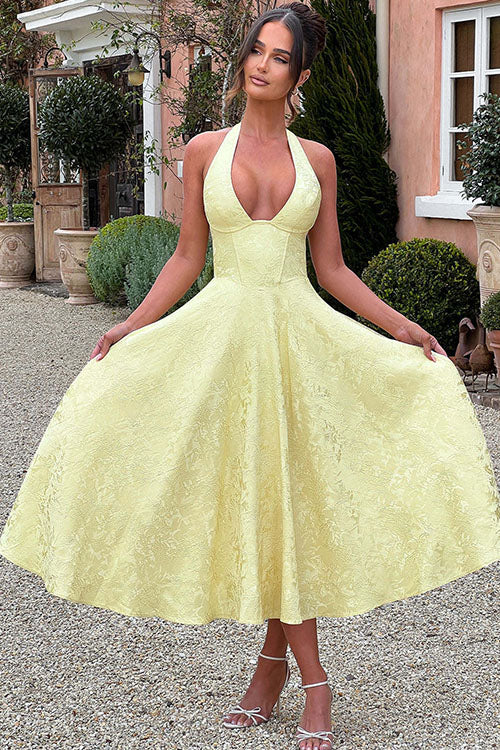 Stylish floral halter midi dress with corset, a flattering option for wedding guests.