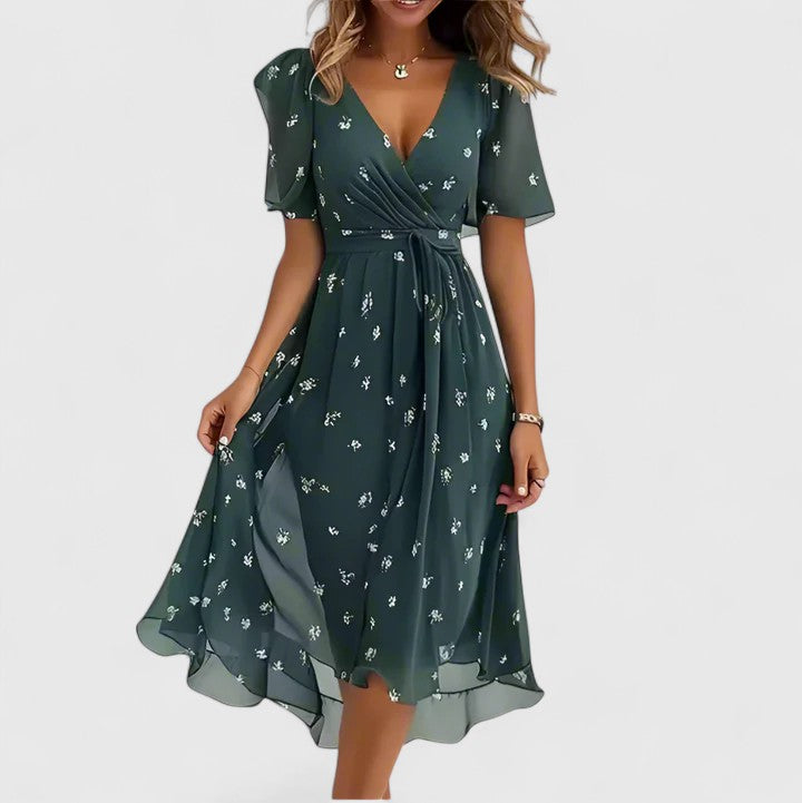 Effortless women's floral midi dress, flutter sleeves, V-neck. Cinched waist for comfortable everyday style.