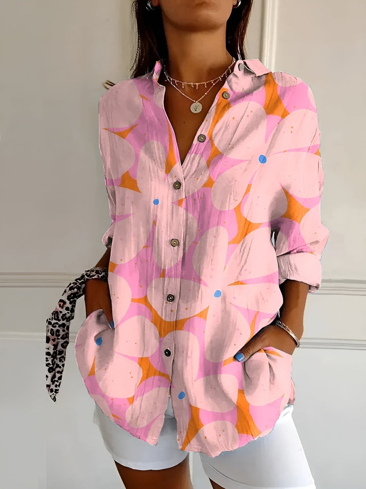 Comfortable women's oversized button-down blouse in a beautiful floral vine print. Perfect for warm weather.