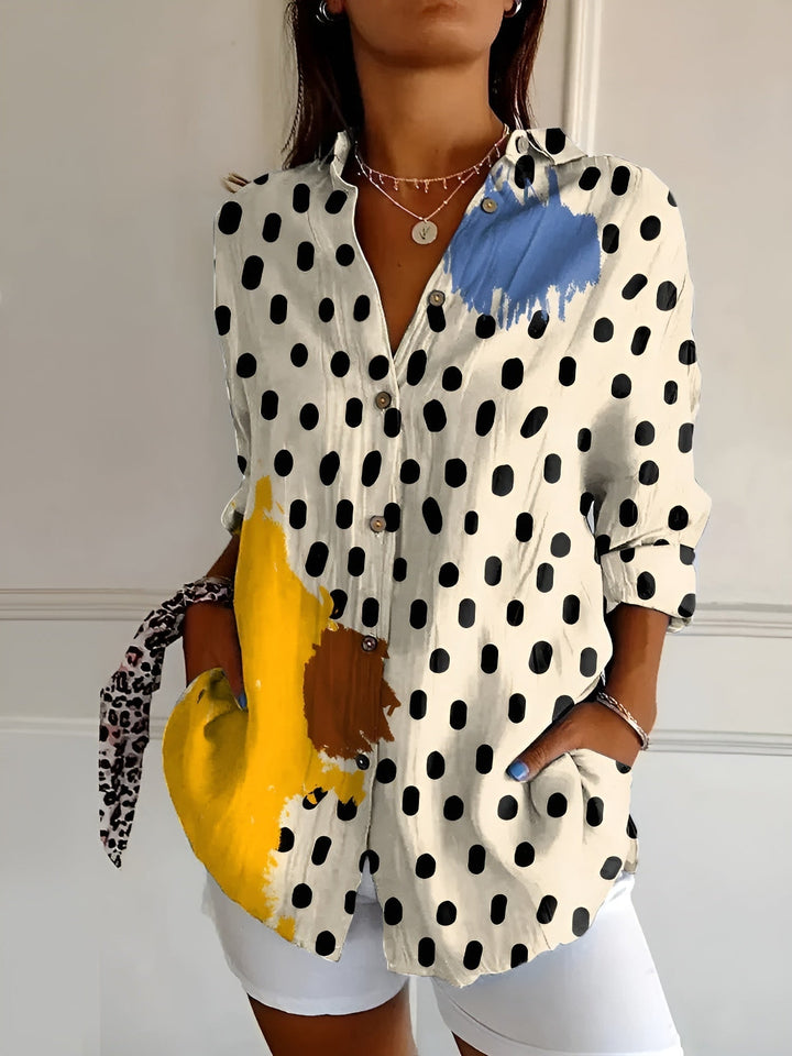 Elegant women's floral print oversized button-down blouse, a relaxed fit top for stylish summer outfits.