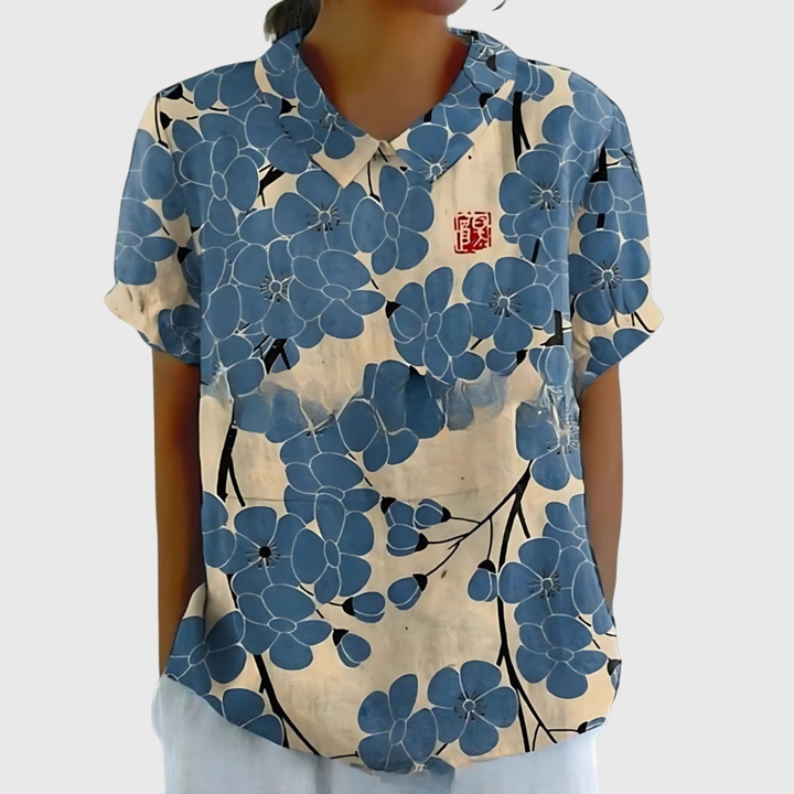 Women's short sleeve floral blouse with Peter Pan collar, breathable fabric, excellent for warm weather everyday style.