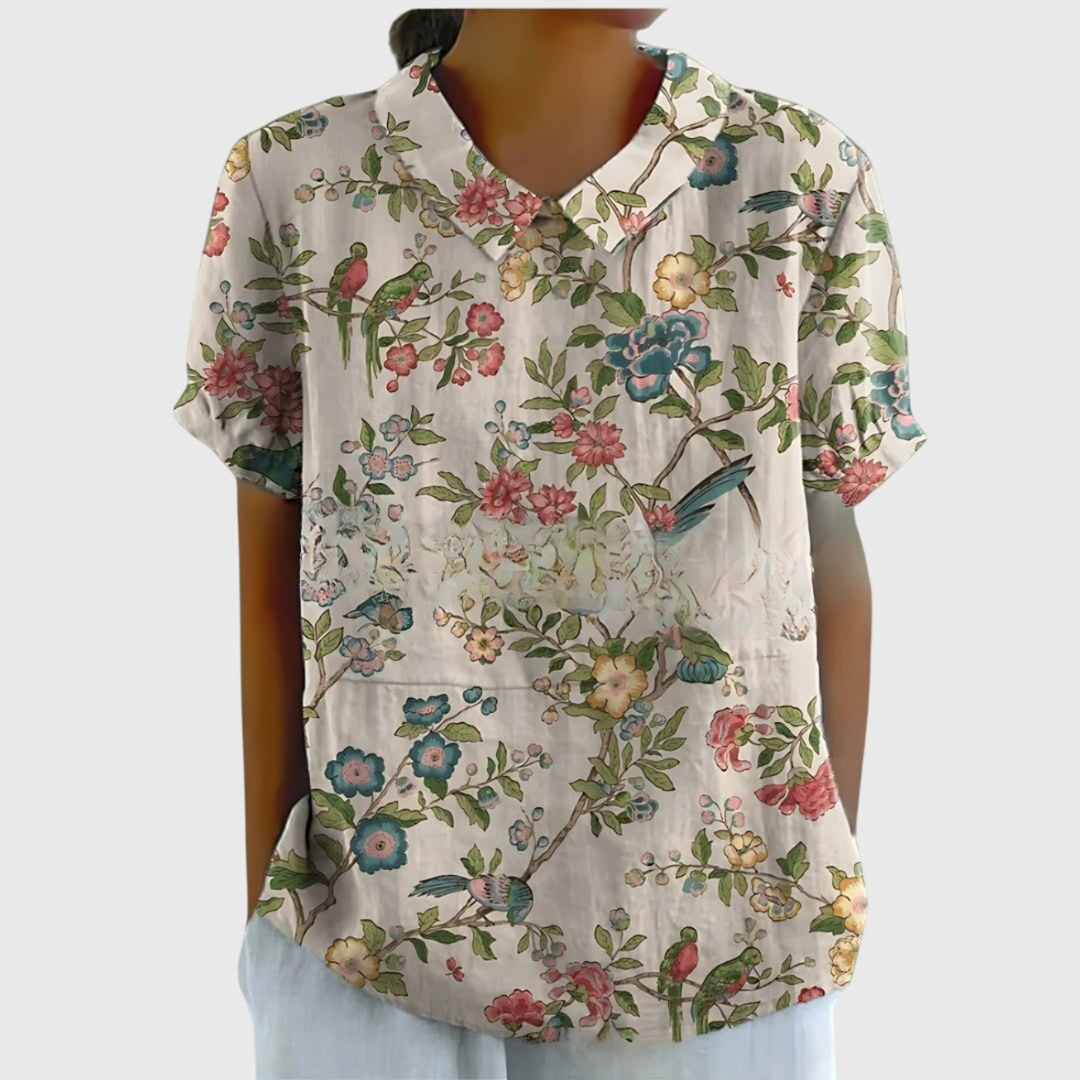 Women's short sleeve collared floral blouse, relaxed fit, breathable fabric, an elegant top for summer fashion.