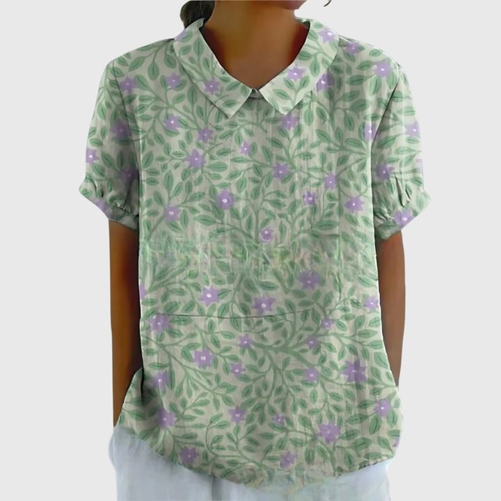Women's short sleeve floral collared shirt, elegant and breathable, designed for warm weather and casual style.
