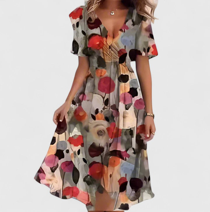 Graceful women's floral V-neck midi dress, offering a flattering fit and delicate flutter sleeves.