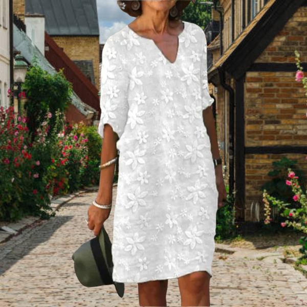 Women's floral V-neck midi dress with pockets, perfect for summer casual wear.