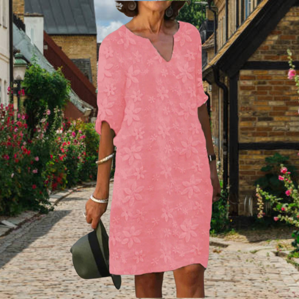 Comfortable floral V-neck midi dress for women, featuring practical pockets. Great summer fashion.
