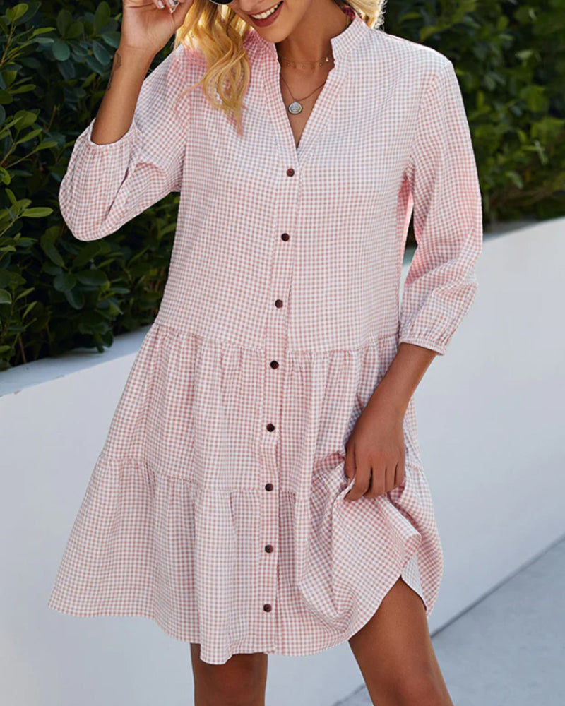 Women's checked A-line summer dress, offering a flowy fit and comfortable style for various casual occasions.