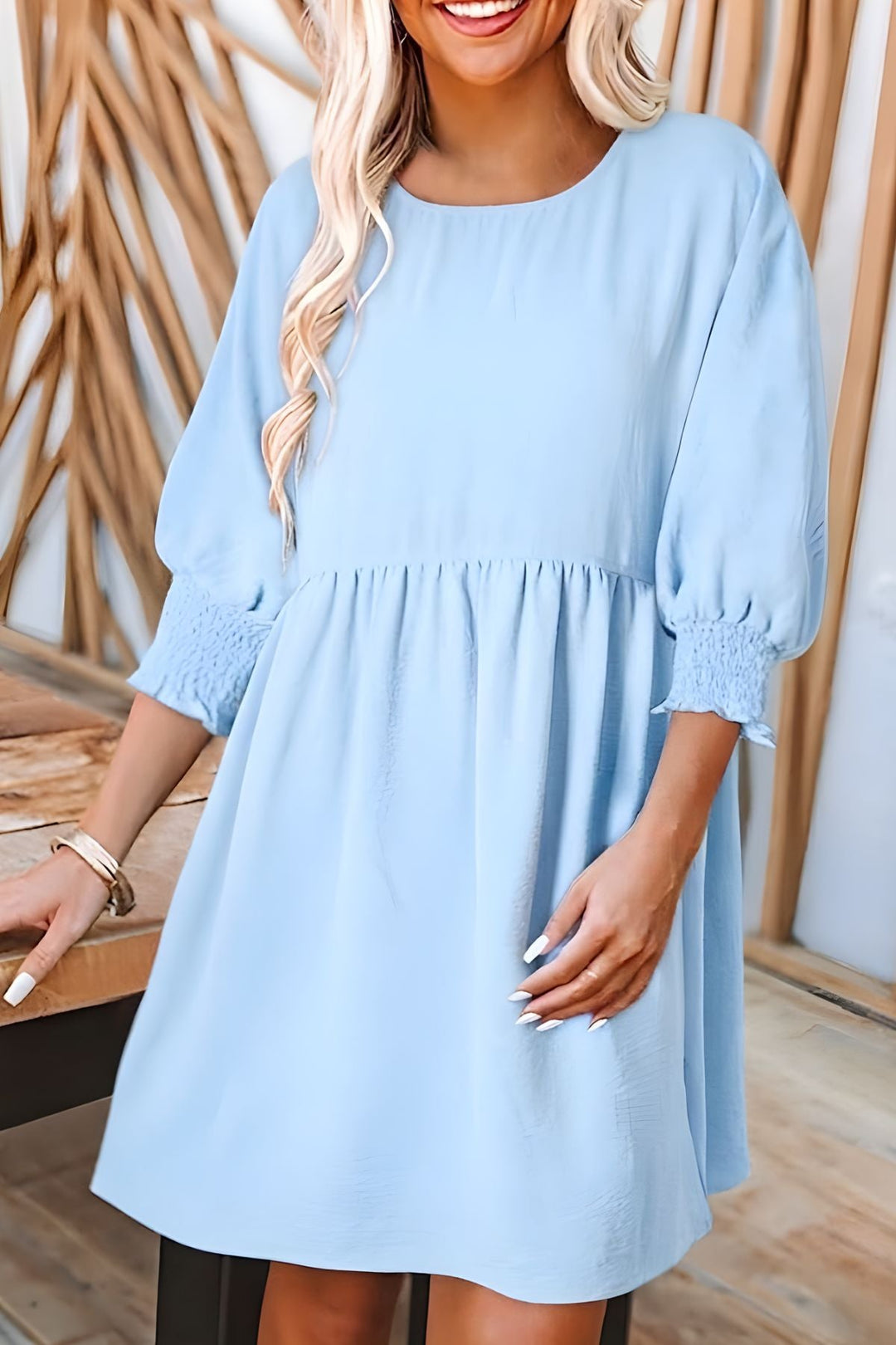 Women's babydoll mini dress with half sleeves & elegant smocked cuffs. A must-have flowy summer dress.