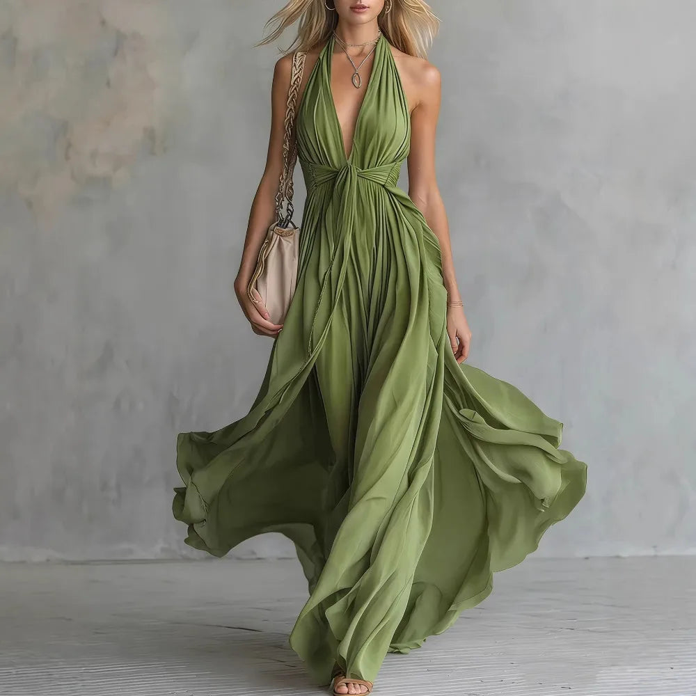 Graceful women's flowy evening gown. Features a pleated halter top and an elegant backless design for formal wear.