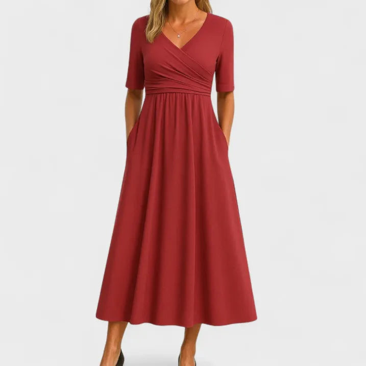 Women's flowy V-neck midi dress for special occasions. Elegant party or wedding guest dress with a flattering fit.