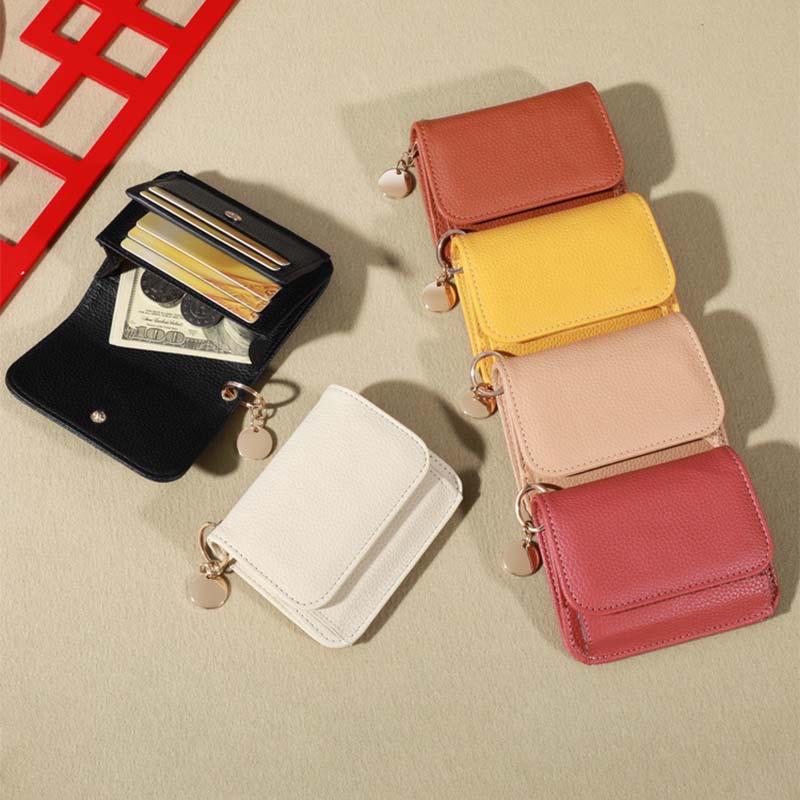 Women's genuine leather mini coin purse in a rich brown color, ideal for everyday carry.