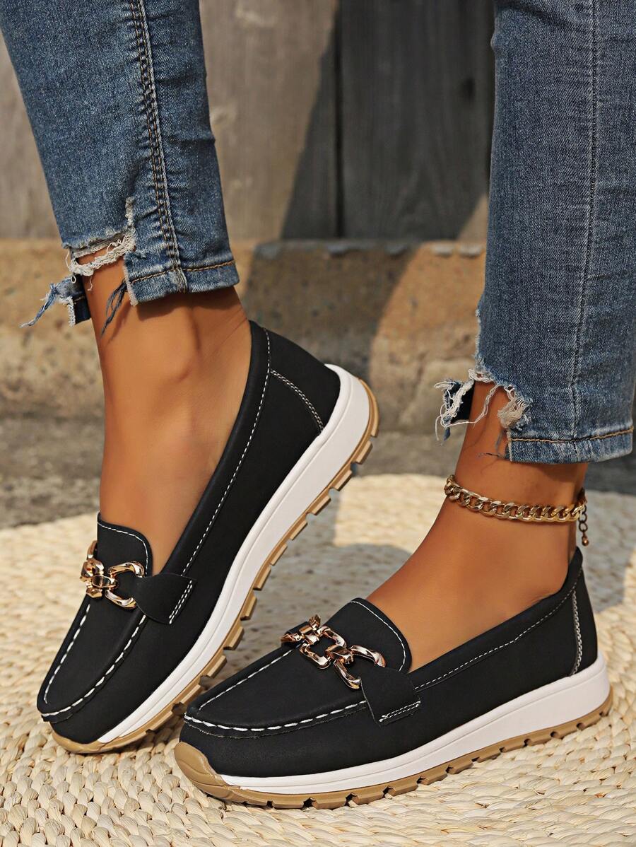 Slip-on women's horsebit loafers with gold accent, providing easy wear and comfortable support.