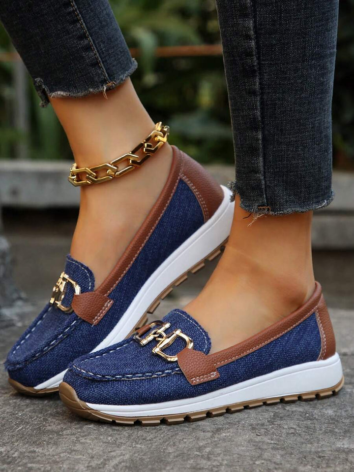 Comfortable women's horsebit loafers with gold trim, perfect for all-day wear.