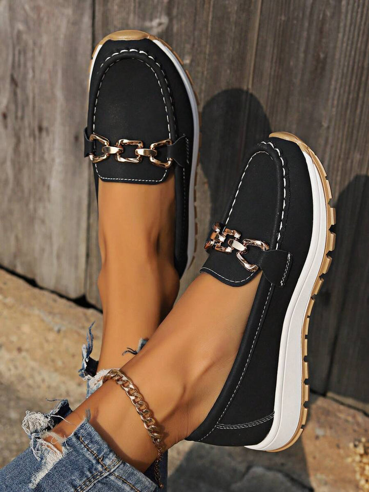 Brown women's horsebit loafers with gold accent, perfect for professional or casual wear.