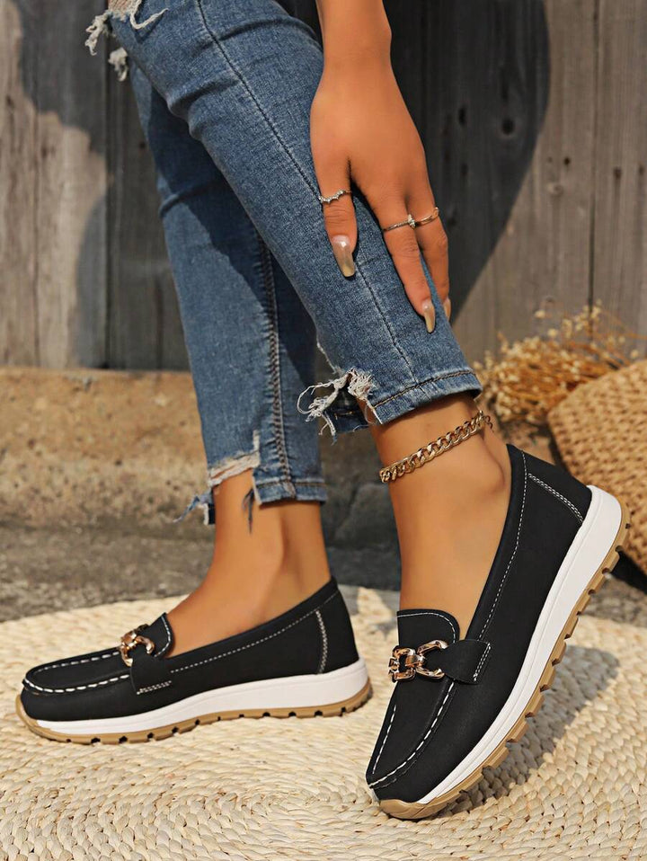 Versatile women's gold-trim horsebit loafers, ideal for professional, casual, or elegant outfits.