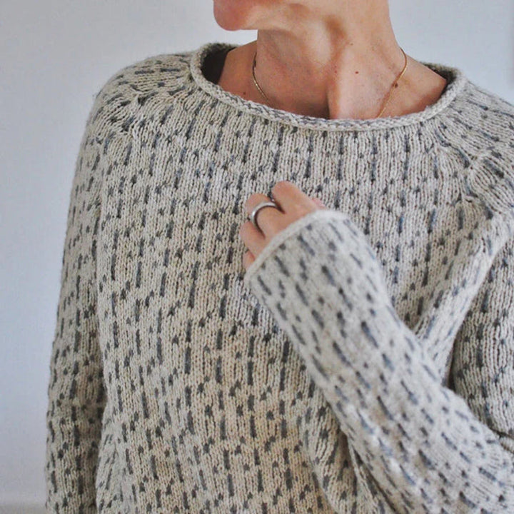 Comfortable grey knitwear sweater for women, featuring a stylish boat neck