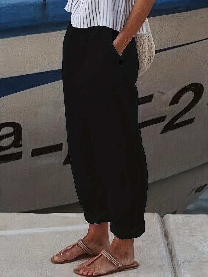 Stylish women's high waist casual pants with a roll hem and relaxed tapered leg.